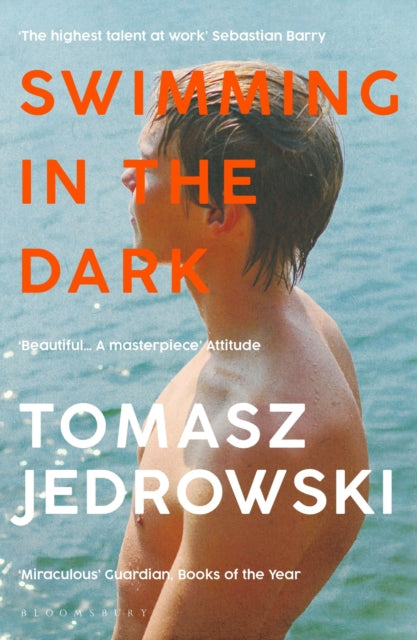 Front cover of Swimming in the Dark by Tomasz Jedrowski, paperback